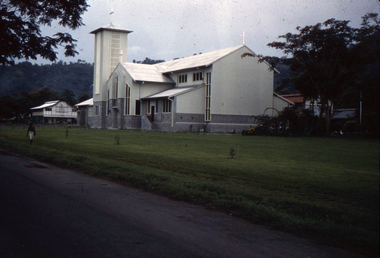 Roman Catholic Church, Rabaul, Papua New Guinea, with Papuan walking along the road.