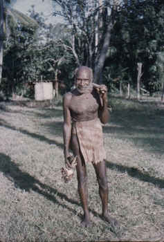An older Papuan man wearing a laplap.