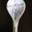 painted flower on a porcelain spoon