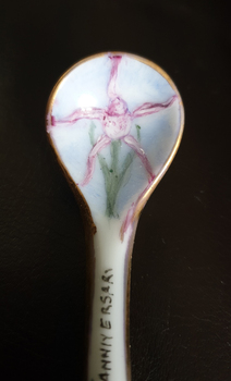 painted flower on a porcelain spoon