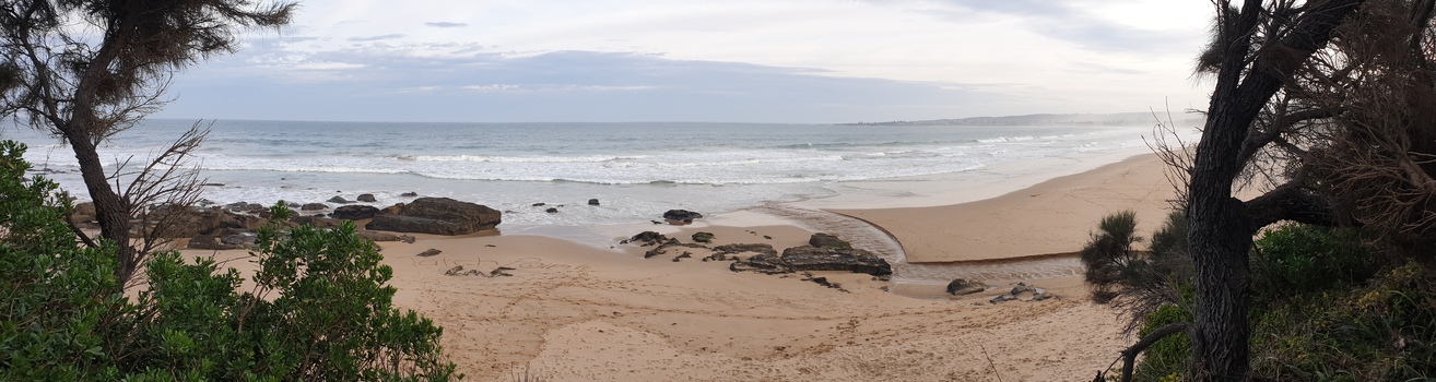 A creek flows into a beach