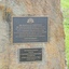 Two metal plaques in a rock