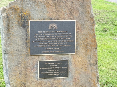 Two metal plaques in a rock