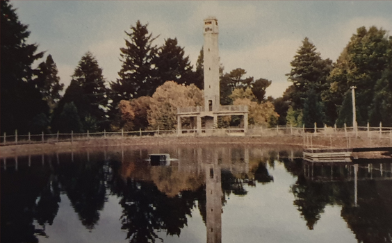 A tower in behind a water storage