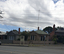 Two houses and an interpretive sign