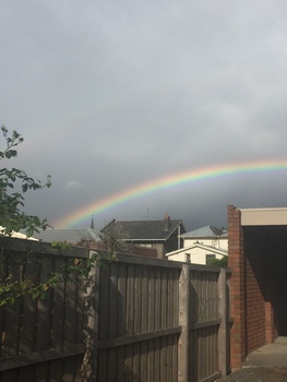 Rainbow and fence
