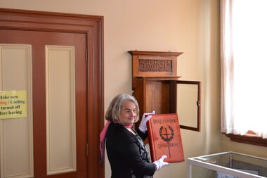 A woman holds a book