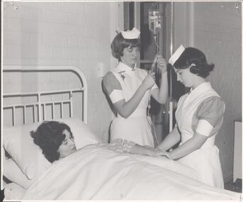 Photograph - Two Nurses attending to a Patient - Lister House