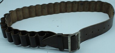 Equipment - Leather cartridge belt with brass buckle. Designed to carry shotgun shells, Circa 1970s