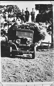 Photograph - Photo - Three men standing on a truck laden with hay