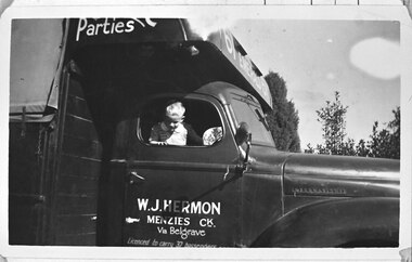Photograph - Photo - John Hermon looking out of a truck owned by his father