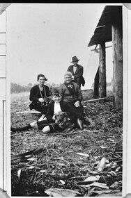 Photograph - Photo - Bill Hermon with his mother, Alice, his father, Bill senior, his aunt, Kitty Quixley, and the family dog, during construction of a shed