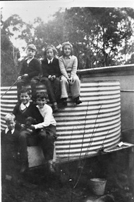 Photograph - Children sitting around a water tank, Belgrave c.1940s