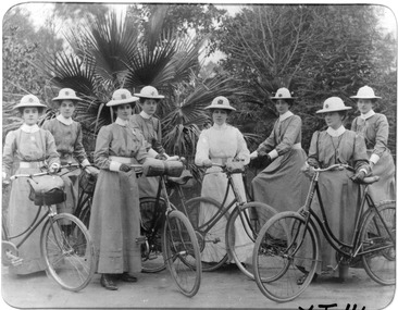 Early photograph of the Melbourne District Nursing Society (MDNS) Matron, Trained nurses, and their bicycles