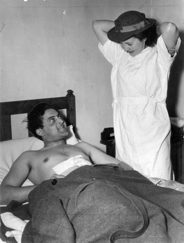 Melbourne District Nursing Society (MDNS) Sister dressing a wound