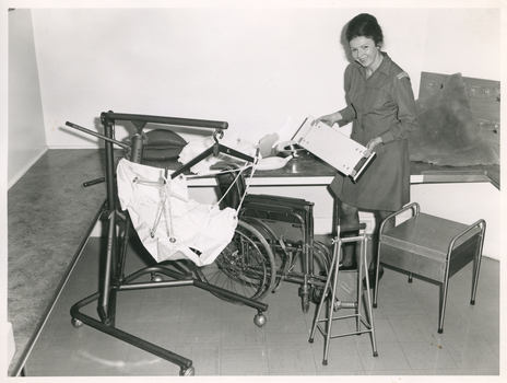 A Royal District Nursing Service (RDNS) Sister viewing RDNS equipment which can be loaned to patients