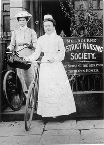 Melbourne District Nursing Society (MDNS) Sister-in-Charge with one of her Trained nurses (Nurse) and their bicycles.