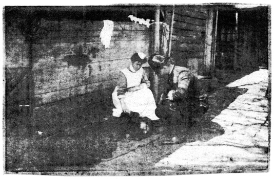 Early Melbourne District Nursing Society (MDNS) Trained nurse and Policeman attending a man collapsed on the street