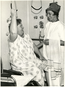 A Royal District Nursing Service (RDNS) Sister observing a patient using a transferring technique in her bathroom
