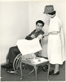 A Royal District Nursing Service (RDNS) Sister administering an injection