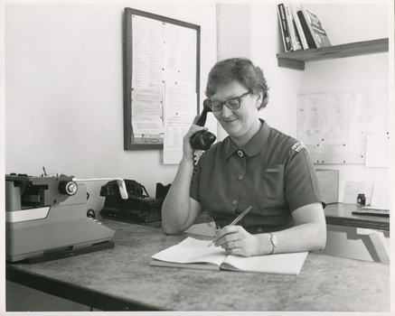 A Royal District Nursing Service (RDNS) Sister working in the Control Room at RDNS Headquarters