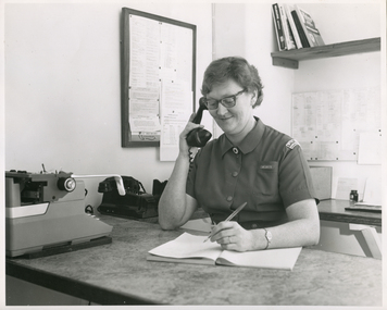 A Royal District Nursing Service (RDNS) Sister working in the Control Room at RDNS Headquarters