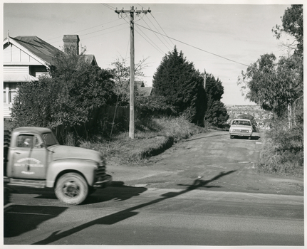 A Royal District Nursing Service (RDNS) Sister driving on an unmade road