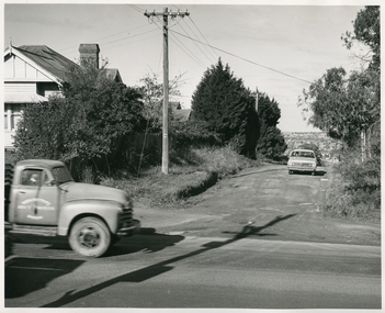 A Royal District Nursing Service (RDNS) Sister driving on an unmade road