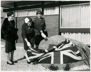Mrs. R. Gordon unveiling a Memorial Plaque to Caroline Chisholm outside RDNS Essendon Centre