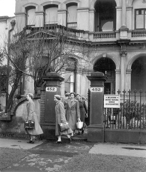 A group of Melbourne District Nursing Society (MDNS) Sister leaving their Headquarters to administer nursing care in the community