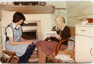 A Royal District Nursing Service (RDNS) Sister providing information to a patient