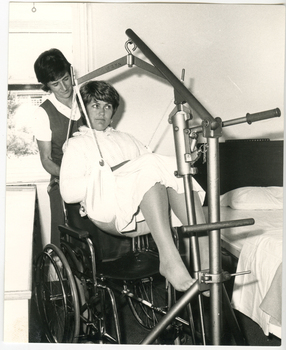 Two Royal District Nursing Service (RDNS) Sisters demonstrating a transferring technique