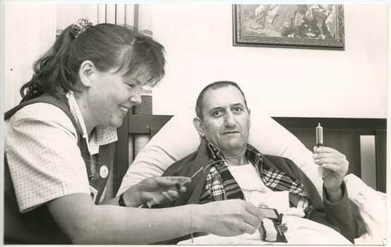 A Royal District Nursing Service (RDNS) Sister administering nursing care