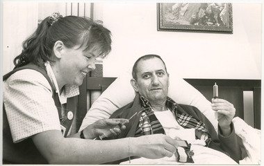 A Royal District Nursing Service (RDNS) Sister administering nursing care
