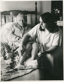 A Royal District Nursing Service (RDNS) Sister attending to a ladies wound