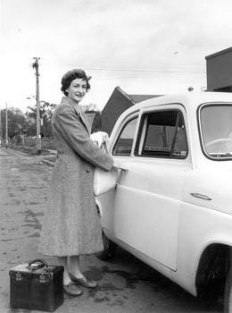 A Melbourne District Nursing Society (MDNS) Sister leaving to give nursing care to a patient in the community