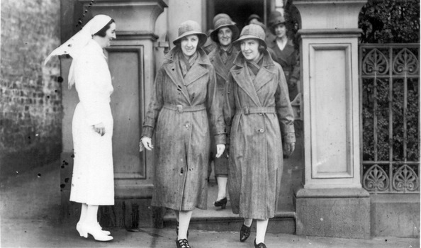 Matron watching her Melbourne District Nursing Society (MDNS) Sisters leaving their Nurses Home