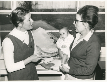 A Royal District Nursing Service (RDNS) Liaison Officer visiting a babe in a Hospital