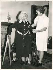 A Royal District Nursing Service (RDNS) Sister assisting a lady to ambulate