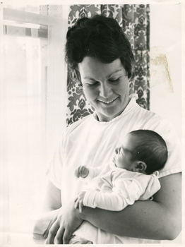 A Royal District Nursing Service (RDNS) Sister visiting to give Post Natal care