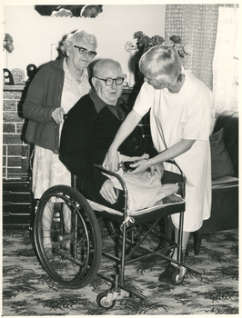A Royal District Nursing Service (RDNS) Sister attending to a gentleman in his home