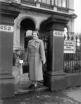 Melbourne District Nursing Society (MDNS) Sister Beryl Hawker leaving Headquarters to administer nursing care in the community