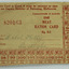 Printed rectangular piece of paper with red text showing squares for 16 rations. Made out to Mabel Kelly in handwriten ink.