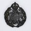 Blackened brass badge with crown on top and leaf crest either side of the letters RAAF in centre