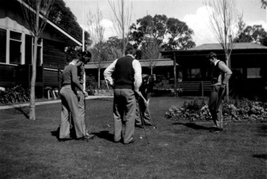 Photograph, A black & white photo of men practicing their golf putts outdoors, in the 1940s at Gresswell Sanitorium - Mont Park, 1940s