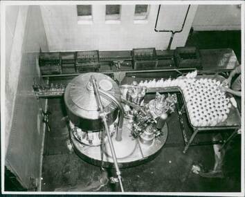 Photograph, Photo of a conveyor line showing milk being bottled. This was a publicity photo from the Department of Health marketing & promoting hygiene & public health