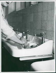 Photograph, Publicity shot of a women demonstrating hand-washing circa 1960s - DEPARTMENT OF HEALTH - PUBLICITY PHOTOGRAPHS