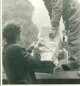 Photograph, Photo taken for display purposes by the Australian Institute of Engineers (AIE) Exhibition 1960, of man handing, or taking a tied parcel of Metters Garbage Bags, from flat bed truck to another man standing on the ground - Mont Park Occupational Therapy Unit