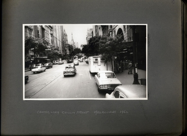 Photograph, A chest x-ray caravan, with a qeue, operating outside of Centreway Arcade Collin St, looking towards the Melbourne City Town Hall, and further up St Patricks - 1 of 3 Photos - Department of Health - Tuberculosis Branch - Publicity material