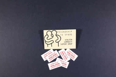 Photograph, "Friendship to Spare" written on a card / badge and an example of Winlaton Community Support Group material that was distributed